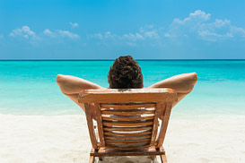 Man-Relaxing-on-Beach Man-Relaxing-on-Beach