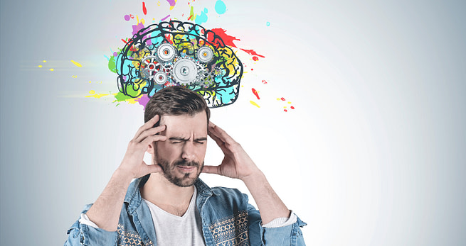Overcoming-LSD A man holding his head with hands