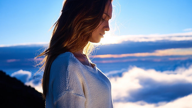 1726762352540 A calm woman over a mountain