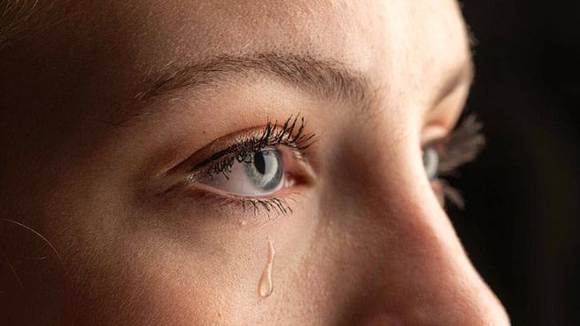 Closeup,Photo,Of,A,Young,Woman,Crying,With,A,Tear Closeup Photo Of A Young Woman Crying With A Tear