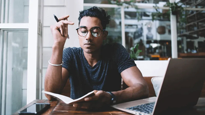 triggers-person-journaling-at-their-desk-min triggers person journaling at their desk