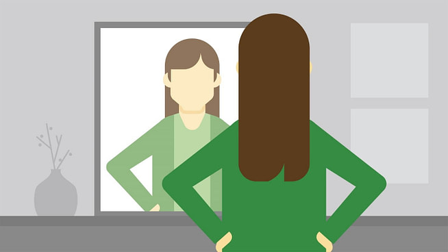 in-h-ass A woman seeing her in the mirror