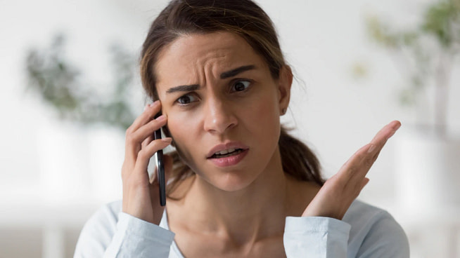 phrases-passive-aggressive-people A aggressive woman talking over a phone