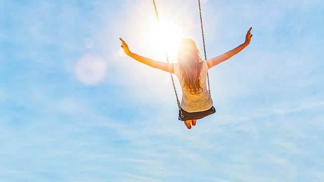 spiritual_freedom-1240_x_698 A woman enjoying a swing in the sun