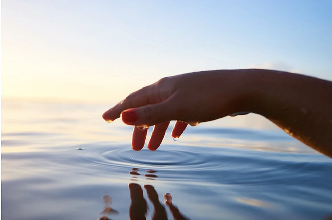 48-laws-of-power-law-26 a hand touching water