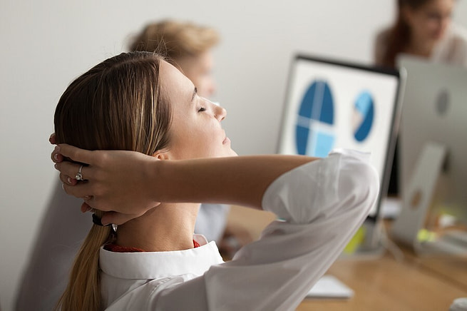A woman in the office seems focused to work