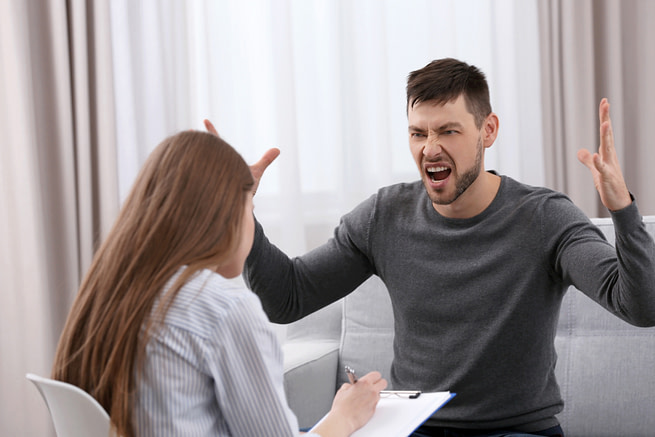 Young man on reception for family psychologist Young man on reception for family psychologist